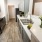 Renovated kitchen featuring a sink in front of the kitchen stove