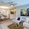 Living and dining room featuring a blue-white themed sofa and a dining set for three people